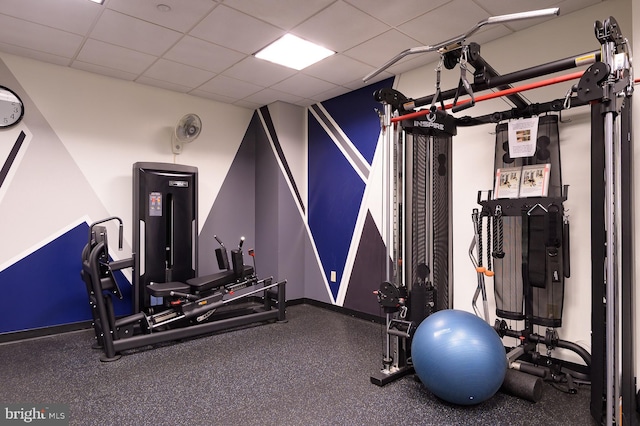 workout area with a drop ceiling