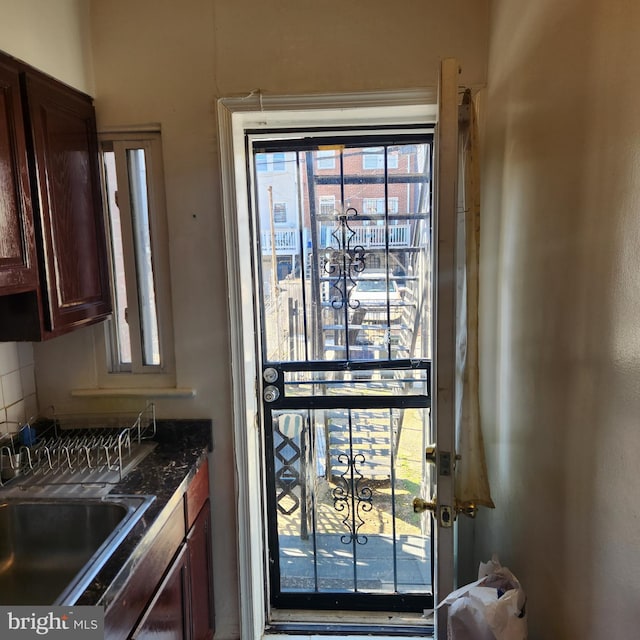 kitchen featuring sink and decorative backsplash