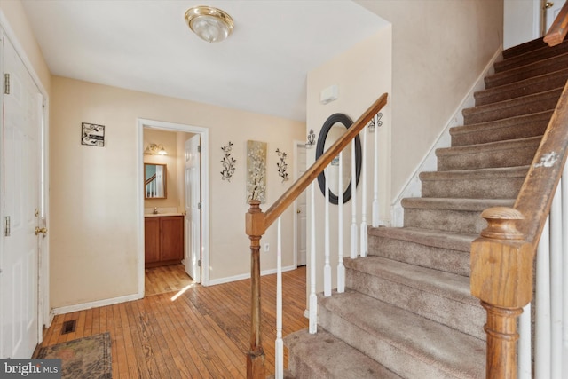 foyer entrance with light wood-type flooring