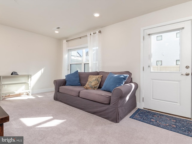 living room with light colored carpet