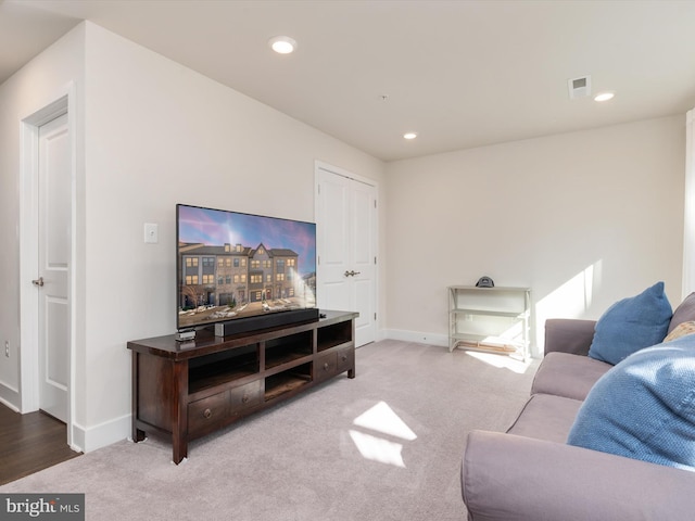 living room featuring light colored carpet