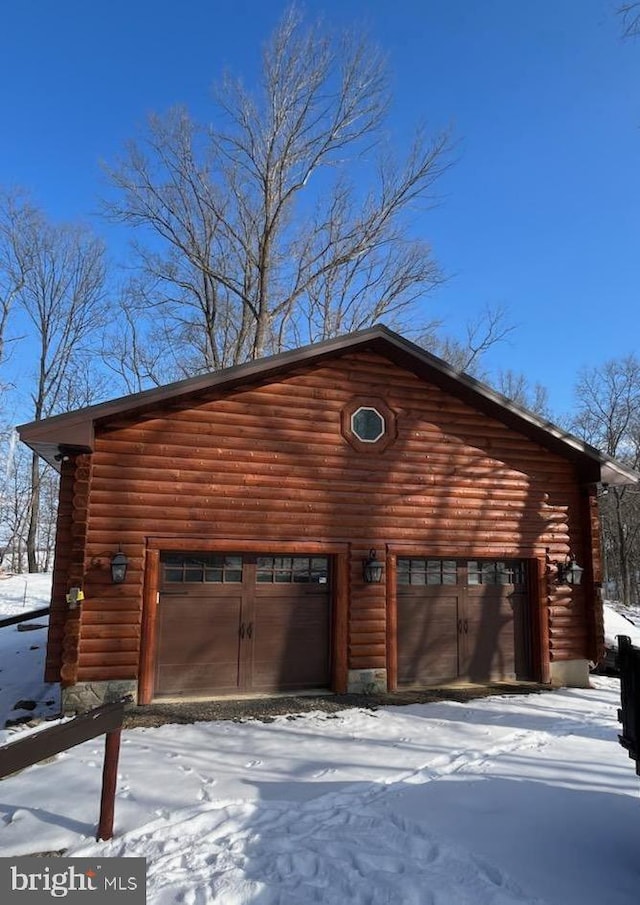 view of snow covered garage