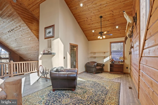 sitting room with wooden ceiling, hardwood / wood-style floors, and a wealth of natural light