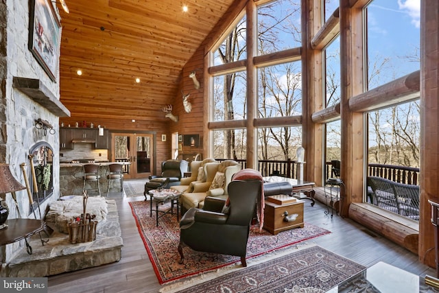 interior space featuring hardwood / wood-style floors, a wealth of natural light, and wooden ceiling