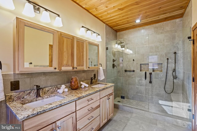 bathroom featuring decorative backsplash, vanity, wooden ceiling, and walk in shower