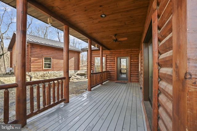 wooden terrace featuring ceiling fan