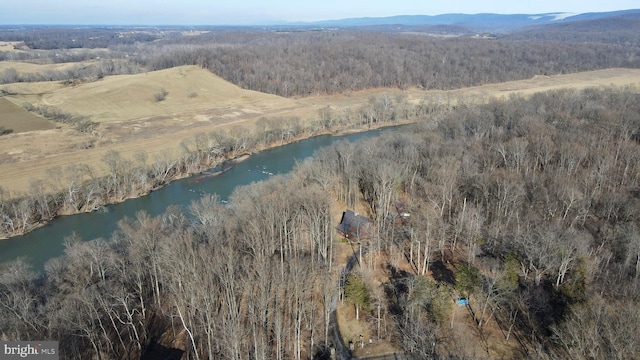 birds eye view of property featuring a water and mountain view