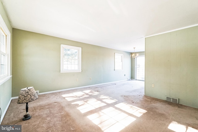 empty room with a notable chandelier