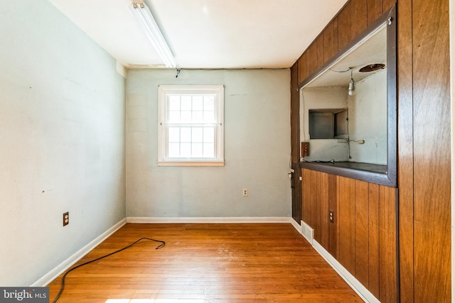 spare room with hardwood / wood-style flooring