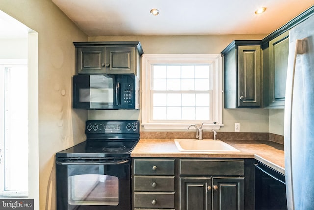 kitchen featuring sink and black appliances