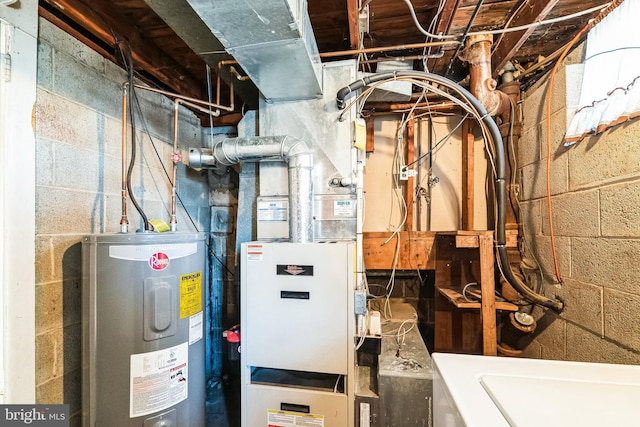 utility room featuring water heater