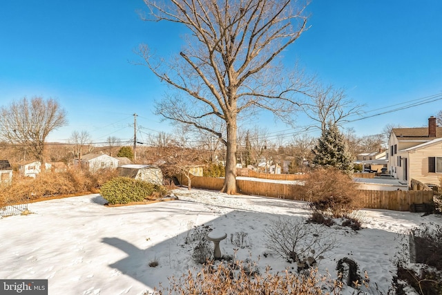 view of yard covered in snow