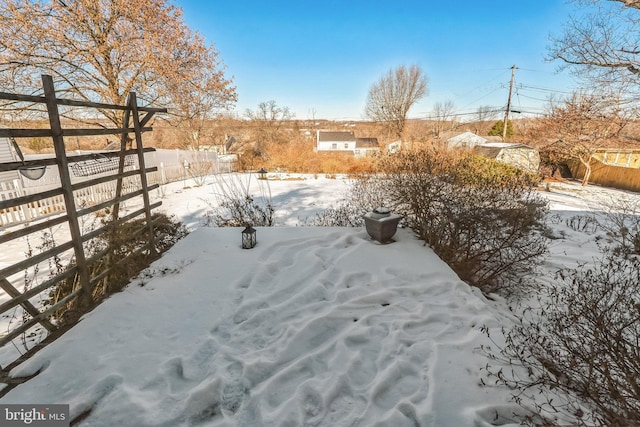 view of yard layered in snow