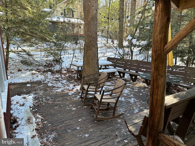 view of snow covered deck