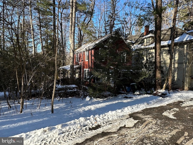 view of yard layered in snow