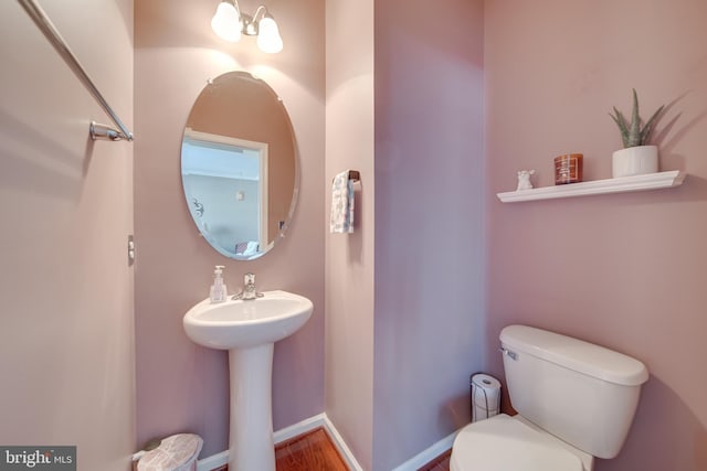 bathroom featuring toilet and sink