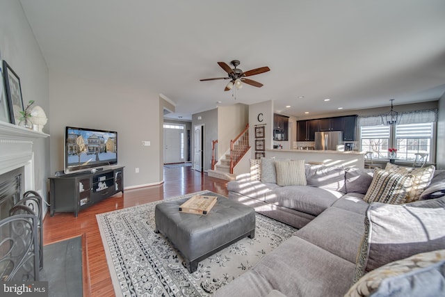 living room with hardwood / wood-style flooring and ceiling fan