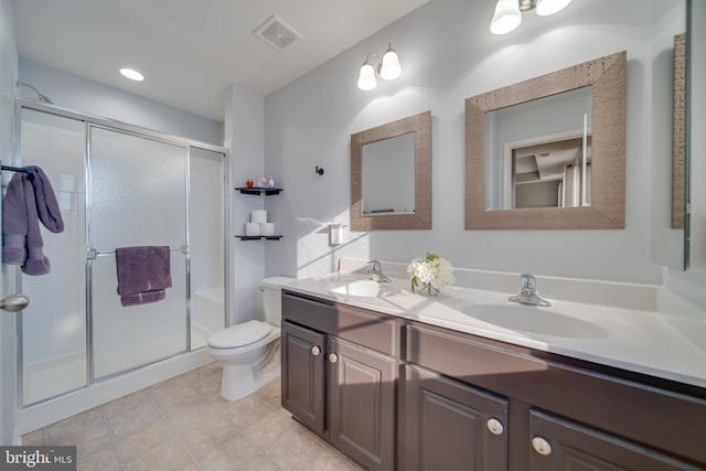 bathroom featuring vanity, toilet, and walk in shower