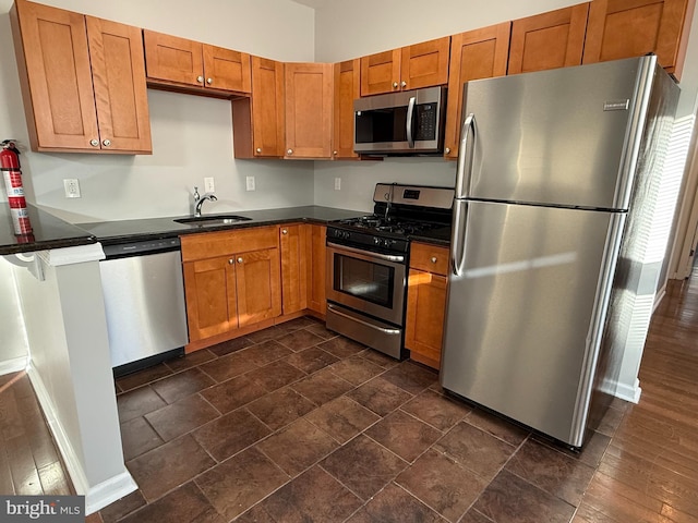 kitchen with appliances with stainless steel finishes and sink