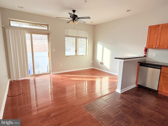 kitchen with dark hardwood / wood-style flooring, ceiling fan, and dishwasher