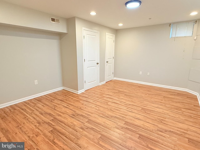 basement featuring light wood-type flooring