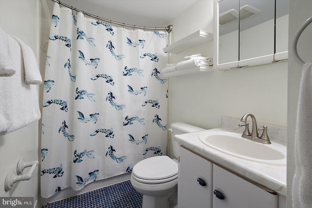 bathroom with vanity, tile patterned flooring, curtained shower, and toilet