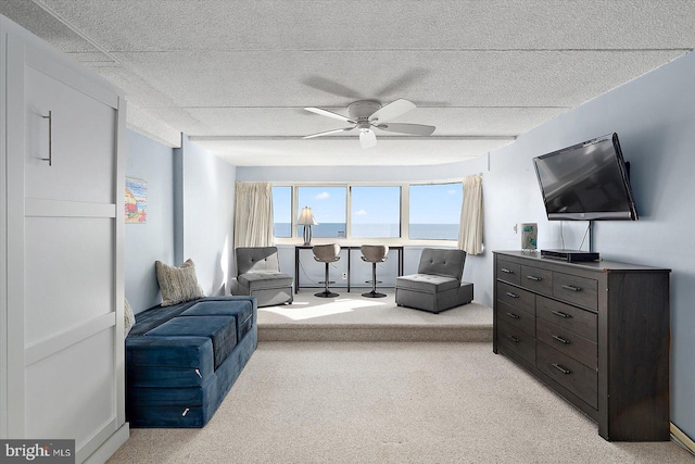 living room with light carpet and ceiling fan