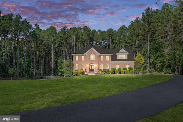 view of front of home with a lawn