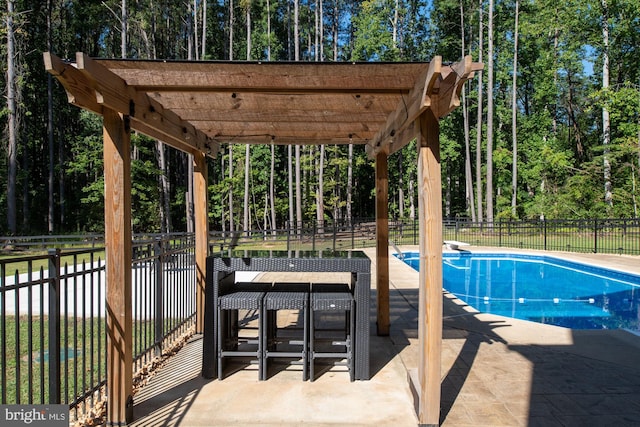 view of pool with a pergola, a diving board, and a patio