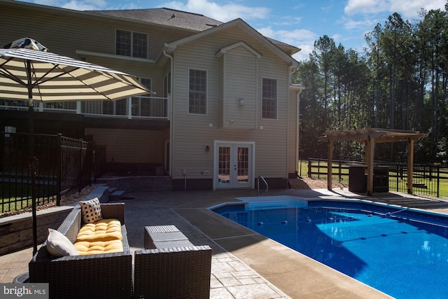 view of pool with french doors, an outdoor hangout area, a pergola, and a patio area