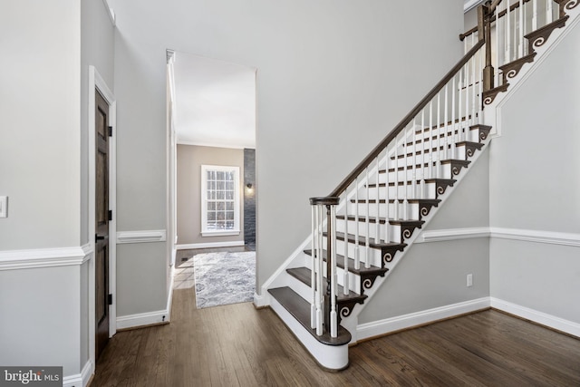 stairway featuring hardwood / wood-style floors