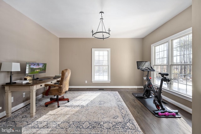 home office with a notable chandelier and wood-type flooring