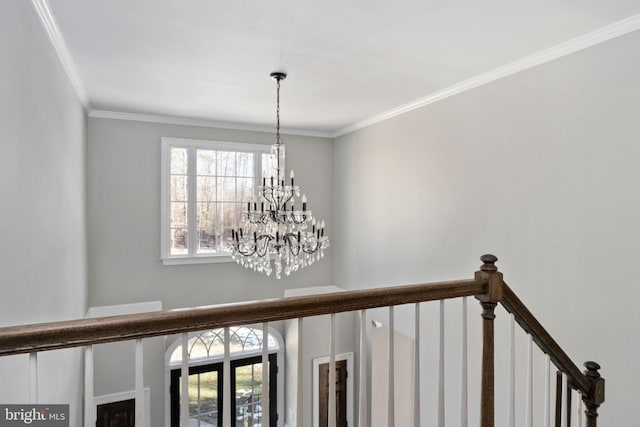 details with an inviting chandelier and crown molding