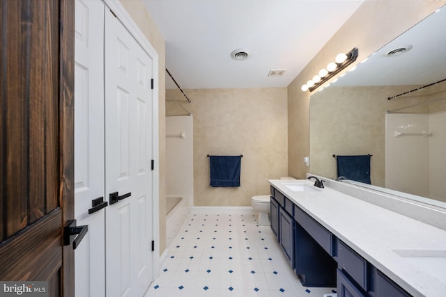 full bathroom featuring shower / bath combination, vanity, and toilet