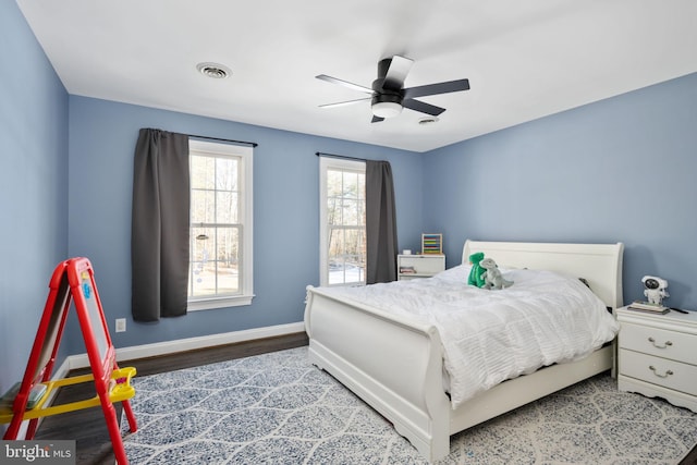 bedroom with wood-type flooring and ceiling fan