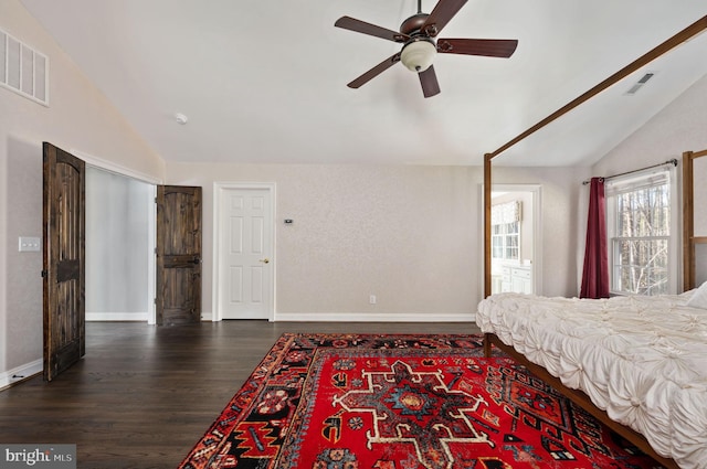 bedroom featuring ceiling fan, dark hardwood / wood-style flooring, and vaulted ceiling