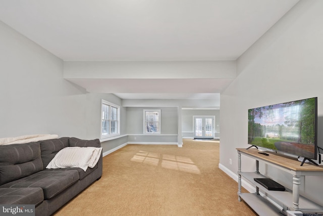 living room with light colored carpet and french doors