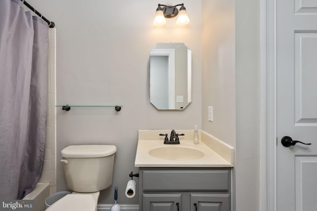 full bathroom with vanity, toilet, and shower / bath combo with shower curtain