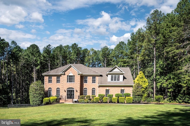 colonial-style house with a front lawn