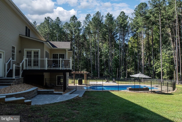 view of yard with a fenced in pool and a pergola