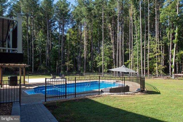 view of swimming pool featuring a yard, a patio area, and a pergola