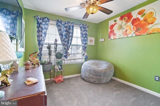 recreation room with ceiling fan, baseboards, and carpet flooring