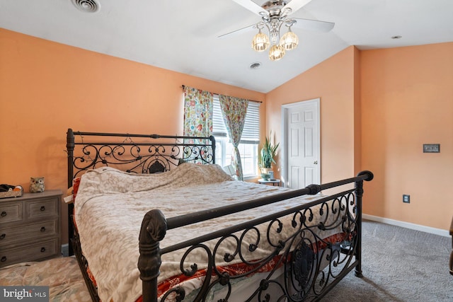 bedroom featuring vaulted ceiling, light carpet, visible vents, and baseboards