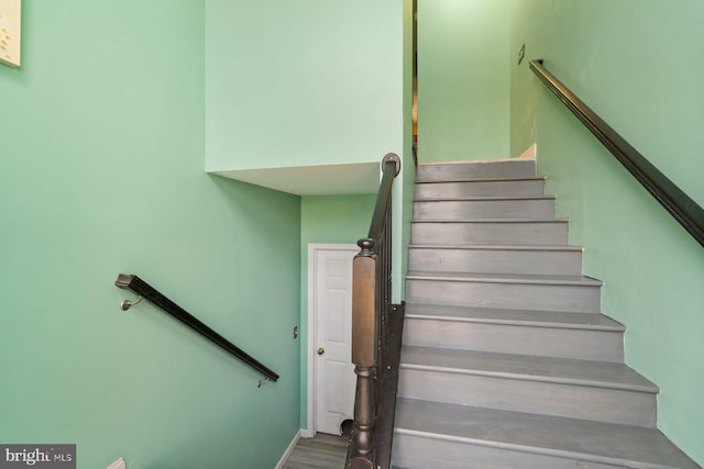 stairway with wood finished floors