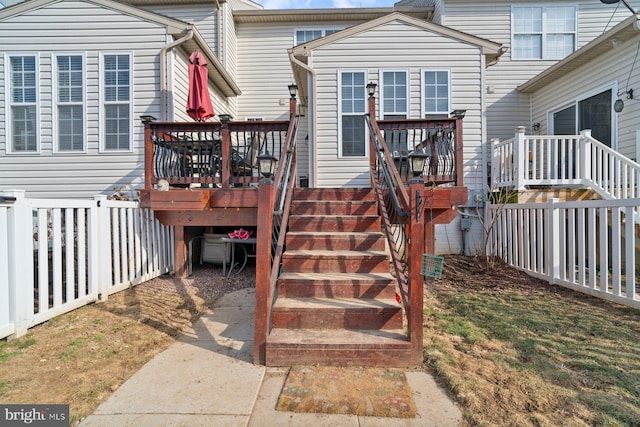 exterior space with fence and stairway