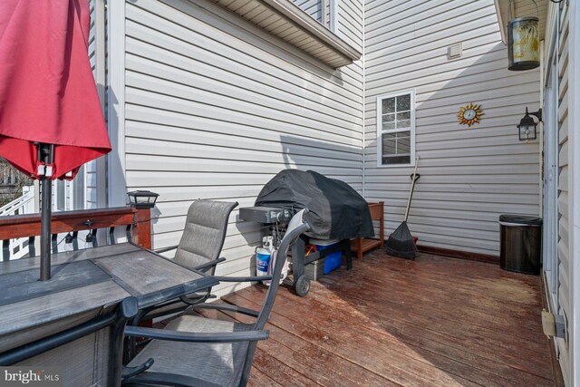 wooden deck featuring area for grilling