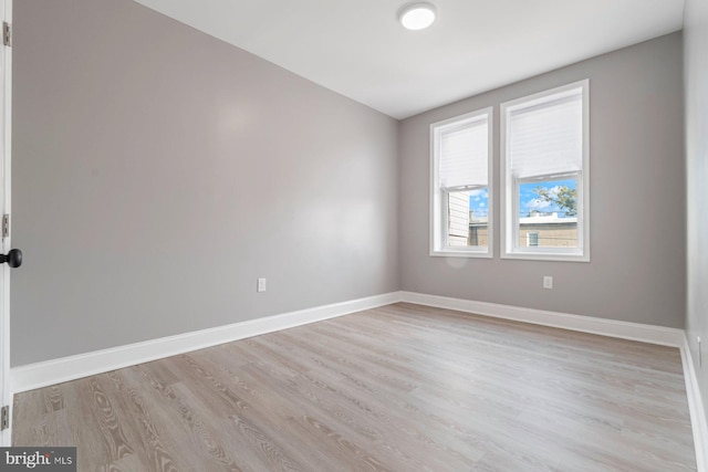 unfurnished room featuring light wood-type flooring