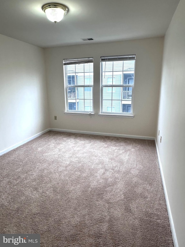 spare room with carpet flooring