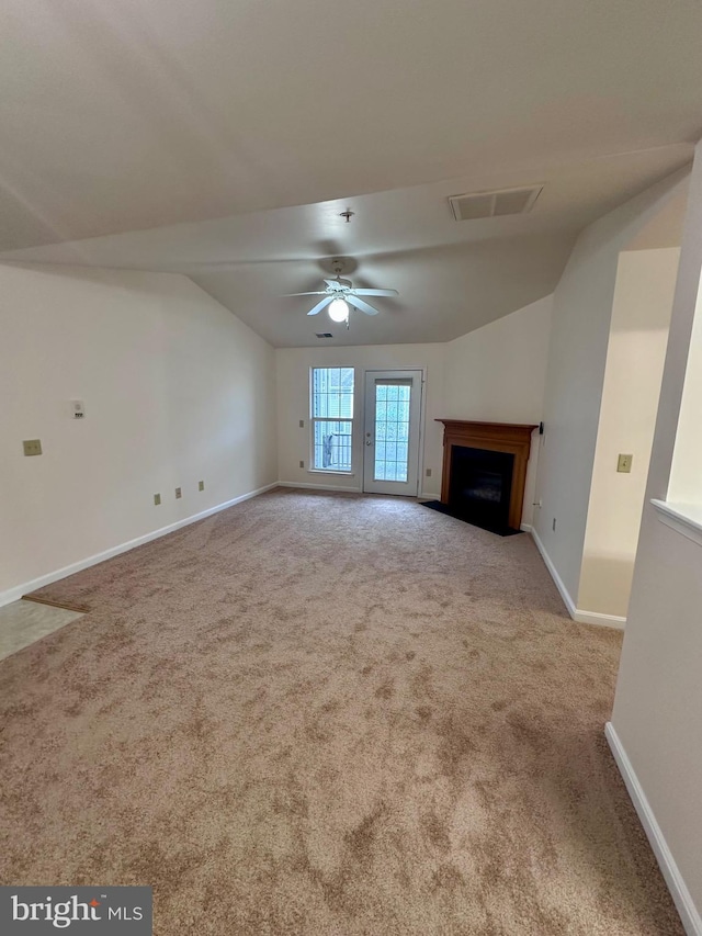 unfurnished living room with light carpet, lofted ceiling, and ceiling fan