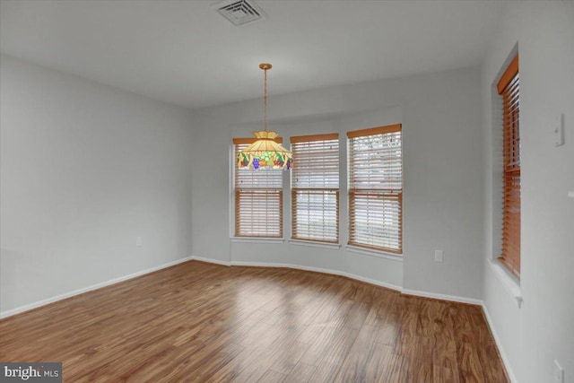 empty room with hardwood / wood-style floors